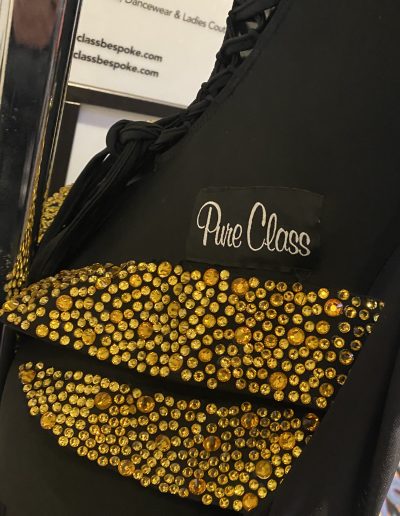 Close up of the Black and gold Couture Gown