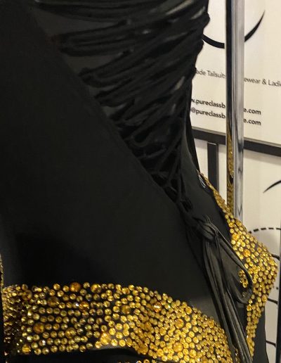 Close up of the Black and Gold Couture Gown showing the back of the dress.